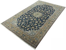 Corner detail of 1950s Ghom rug showing border pattern and Cork pile