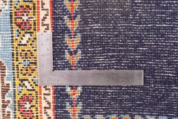 Corner detail of 2001s Ghom rug showing border pattern and Wool pile