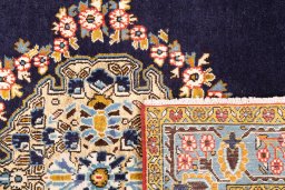 Close-up detail of 2001s Ghom rug from Iran / Persia showing Wool weave