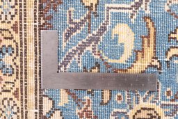 Corner detail of 1999s Ghom rug showing border pattern and Wool pile