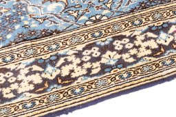 Backside of handmade 1999s Ghom rug showing knot structure and weave density