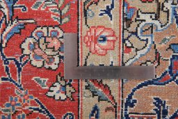 Corner detail of 1980s Ghom rug showing border pattern and Wool pile