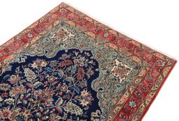 Surface texture of 1980s Ghom rug with natural Wool and intricate pattern