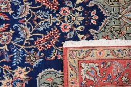 Close-up detail of 1980s Ghom rug from Iran / Persia showing Wool weave