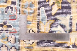 Corner detail of 2001s Ghom rug showing border pattern and Wool pile