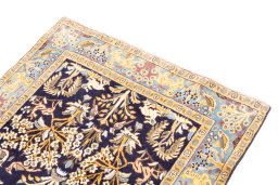 Surface texture of 2001s Ghom rug with natural Wool and intricate pattern