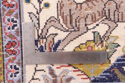 Close-up detail of 2000s Ghom rug from Iran / Persia showing Wool weave