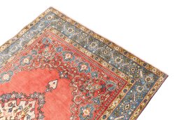 Surface texture of 1970s Ghom rug with natural Wool and intricate pattern