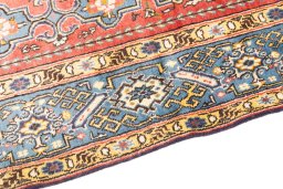 Backside of handmade 1970s Ghom rug showing knot structure and weave density