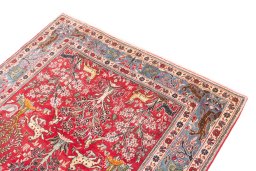 Surface texture of 1988s Ghom rug with natural Wool and intricate pattern