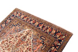 Surface texture of 1972s Ghom rug with natural Wool and intricate pattern