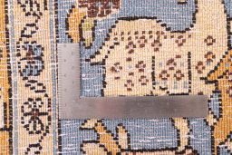 Surface texture of 1988s Ghom rug with natural Wool and intricate pattern