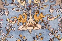 Corner detail of 1988s Ghom rug showing border pattern and Wool pile