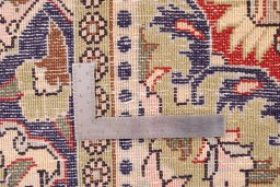 Corner detail of 1979s Ghom rug showing border pattern and Wool pile