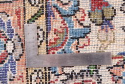 Corner detail of 1998s Ghom rug showing border pattern and Wool pile