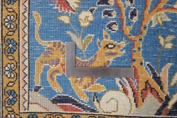Close-up detail of 1990s Ghom rug from Iran / Persia showing Wool weave