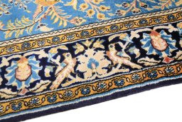 Backside of handmade 1990s Ghom rug showing knot structure and weave density