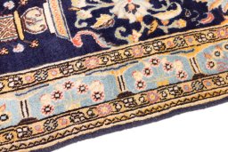 Backside of handmade 1995s Ghom rug showing knot structure and weave density