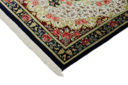 Backside of handmade New Ghom rug showing knot structure and weave density