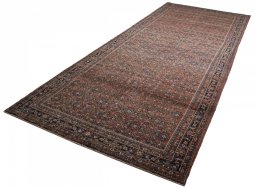 Close-up detail of 2000s Hoseinabad rug from Iran / Persia showing Wool weave