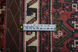 Close-up detail of 2000s Hoseinabad rug from Iran / Persia showing Wool weave