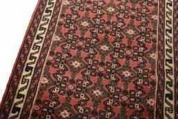 Backside of handmade 2000s Hoseinabad rug showing knot structure and weave density