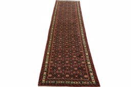 Surface texture of 2000s Hoseinabad rug with natural Wool and intricate pattern
