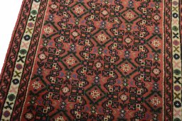Backside of handmade 2000s Hoseinabad rug showing knot structure and weave density