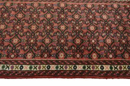 Close-up detail of 2000s Hoseinabad rug from Iran / Persia showing Wool weave