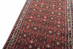 Backside of handmade New Hoseinabad rug showing knot structure and weave density