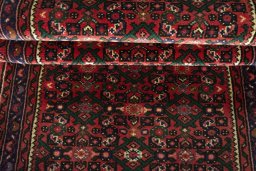 Full view of New Hoseinabad rug from Iran / Persia, 601 × 75 cm in Red tones