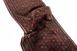 Corner detail of New Hoseinabad rug showing border pattern and Wool pile