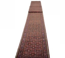 Surface texture of New Hoseinabad rug with natural Wool and intricate pattern