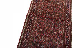 Backside of handmade New Hoseinabad rug showing knot structure and weave density