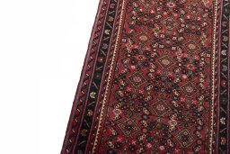 Backside of handmade New Hoseinabad rug showing knot structure and weave density