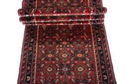 Full view of New Hoseinabad rug from Iran / Persia, 600 × 77 cm in Red tones