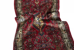 Corner detail of 2000s Hoseinabad rug showing border pattern and Wool pile