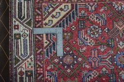 Close-up detail of 2000s Hoseinabad rug from Iran / Persia showing Wool weave