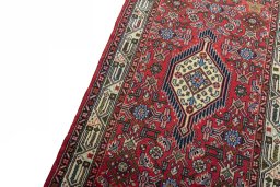 Backside of handmade 2000s Hoseinabad rug showing knot structure and weave density