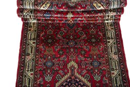 Full view of 2000s Hoseinabad rug from Iran / Persia, 318 × 87 cm in Red tones