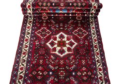 Full view of New Hoseinabad rug from Iran / Persia, 691 × 86 cm in Red tones