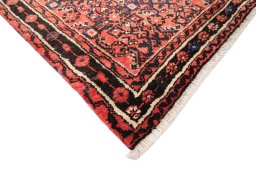 Backside of handmade 1990s Hoseinabad rug showing knot structure and weave density