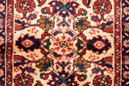 Close-up detail of 1998s Hoseinabad rug from Iran / Persia showing Wool weave