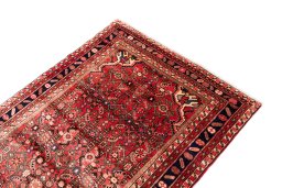 Surface texture of 1972s Hoseinabad rug with natural Wool and intricate pattern