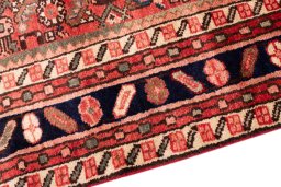 Backside of handmade 1972s Hoseinabad rug showing knot structure and weave density