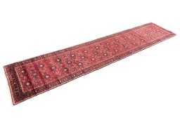 Corner detail of 2000s Hoseinabad rug showing border pattern and Wool pile