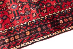 Backside of handmade 2000s Hoseinabad rug showing knot structure and weave density