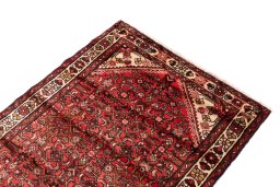 Surface texture of 1975s Hoseinabad rug with natural Wool and intricate pattern