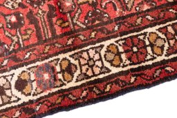 Backside of handmade 1975s Hoseinabad rug showing knot structure and weave density