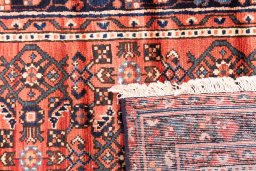 Close-up detail of 1975s Hoseinabad rug from Iran / Persia showing Wool weave